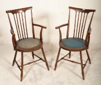 A pair of Victorian 19th century Goldsmith Windsor chairs - armchairs. Raised on turned legs