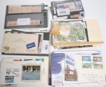 A collection of 1st day covers and stamps to include WInnie The Pooh, Anniversary Sets, Mayday