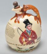 An early 20th Century Crown Devon ceramic John Peel musical flagon flask / decanter having a moulded