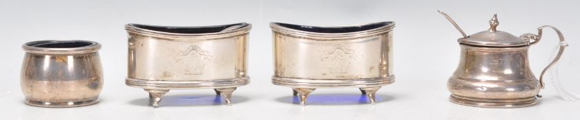 A good matching pair of early 20th Century silver hallmarked table salt condiments of ovular form