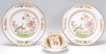 A stunning 19th Century cabinet cup and saucer in the manner of Coalport, with decorative hand