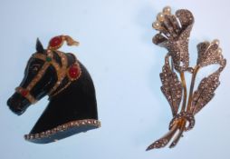 Two vintage mid Century fashion brooches to include a horse brooch set with green, red and white