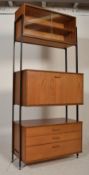 A mid century teak wood modular single bay Avalon system. The metal uprights supporting a bank of