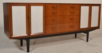 A retro mid century Nathan furniture teak wood sideboard / credenza. Raised on ebonised tapering