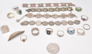 A collection of silver rings and other silver and white metal items of jewellery to include many