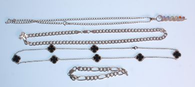 A selection of silver jewellery to include a flat link necklace chain,a figaro link bracelet with