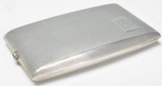 A silver hallmarked cigarette case of rectangular shape having engine turned decoration with