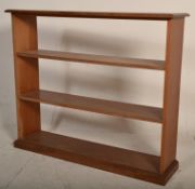 An Edwardian early 20th century solid mahogany open window library bookcase having three shelves