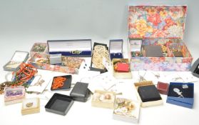 A collection of vintage costume jewellery to include cameo brooches, a gold plated Victorian open