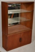 A mid century / circa 1960's Turnidge teak wood library bookcase cabinet having a double door