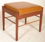 A mid century G-Plan teak wood upholstered foot stool ottoman. Raised on teak wood tapering legs