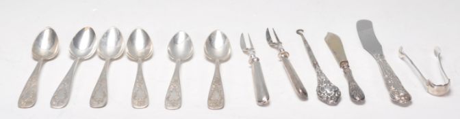 A mixed silver wares dating from the 19th Century to include a pair of silver hallmarked sugar