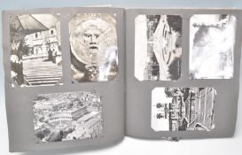 A vintage 20th Century postcard album filled mostly of scenes, architecture, buildings, sculptors in