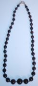 A 20th Century opal beaded necklace having forty round beads of graduation form, on a 9ct gold