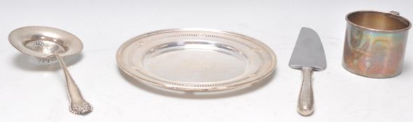 A stamped sterling silver Wallace mug dated to 1940 on the underside with inscription together