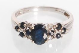 A stamped 9ct white gold ring set with an oval cut