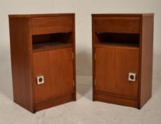 A matching pair of vintage retro 20th Century teak wood bedside cabinets having an open space