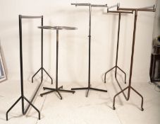 A group of three 20th Century haberdashery shop clothes rails of tubular construction of varying