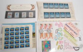 A collection of uncirculated block sheets and part sheets of stamps to include 1969 Christmas