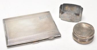 A selection of silver items to include a stamped sterling silver pill pot of round form having