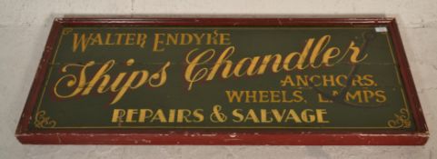 A large colourful wooden 20th century antique style shop advertising sign for Walter Endyke -