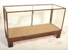 A 1930's / early 20th century shop haberdashery counter being raised on block feet with a