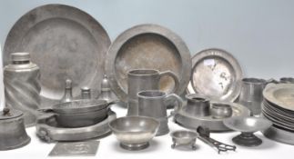 A collection of 18th Century antique pewter wares to include a large selection of plates and