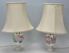 A pair of 20th Century glass table lamps of bulbous tapering form, having faceted decoration to