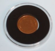 A good  22ct gold 1018 half sovereign coin having Elizabeth II facing right with the George and