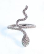 A stamped 925 silver snake ring set with white and green accent stones. Weight 3.2g. Size N.5.