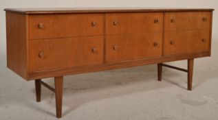 A retro mid century teak wood six drawer sideboard credenza of Danish influence. Raised on square