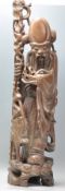 A 20th Century Chinese carved wooden figure in the form of the deity Shou Lau modelled with a