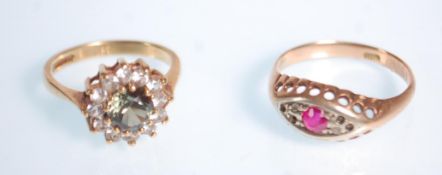 A 9ct gold ring inset with diamonds and red stone Size O / Weight 1.75g together with a green