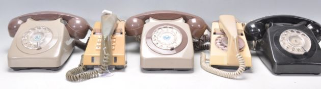A group of three vintage retro 20th Century rotary dial telephones, one being in a black