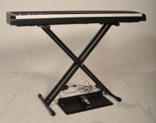 A good Korg B1 Digital keyboard with stand, foot pedal and power pack. Recently pac tested.