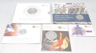 A mixed collection of The Royal Mint presentation coins to include a 2013 fine silver £20 pound coin