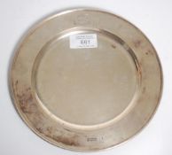 A good Mappin & Webb of London silver hallmarked tray of round form having an engraved coat of arms.