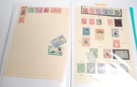 A good collection of block and part sheet stamps along with coinage and notes across two albums from