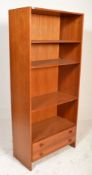 A retro 20th century Danish influence teak wood upright bookcase cabinet. The library bookcase