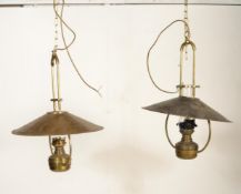 A pair of large and impressive brass ceiling lights of antique form having brass UFO saucer