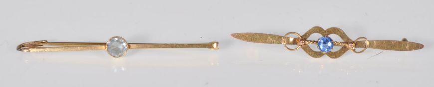 A stamped 15ct gold bar brooch set with a central