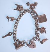 A silver charm bracelet with a heart lock adorned with eight charms including a church, duck, Bible,