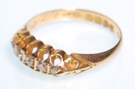 An Edwardian hallmarked 18ct gold ring set with five round cut diamonds. Hallmarked Chester 1904.