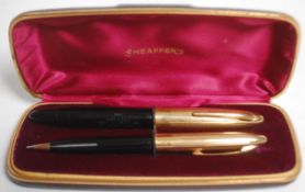 A 20th Century two piece Sheaffer writing set consisting of fountain pen having a 14k gold nib and a