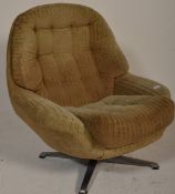 A retro mid century swivel egg chair  having a 4 point swivel base with cream upholstered armchair