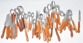 A collection of retro 20th Century Danish inspired teak handled cutlery of shapley form consisting
