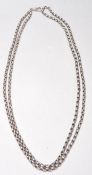A vintage 20th Century silver long guard chain having rounded links. Weighs 89.4g. Measures 30