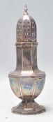 A vintage 20th Century silver hallmarked sugar caster shaker raised on stepped octagonal base with