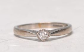 A 9ct white gold ladies single solitaire diamond ring of approx 0.10pts. Total weight 2.6g. Ring