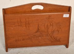 A mid century Chinese camphor wood  / hardwood folding magazine rack stand with carved detailing